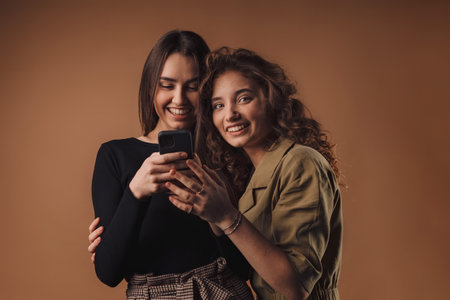 Portrait of two young happy girls, studio shoot,の写真素材