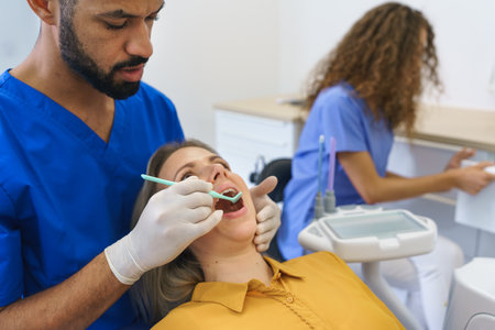 Dental examination of young woman at dental clinic.の写真素材