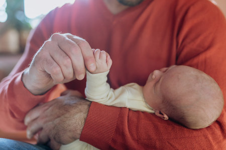 Close-up of father holding his little son.の写真素材