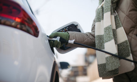 Close up of urecognizable person charging electric car.の写真素材