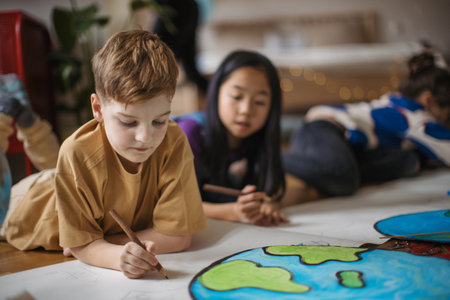 Happy friends drawing together in a room.の写真素材