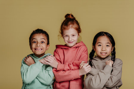 Portrait of three children, studio shoot. Concept of diversity in friendship.の写真素材