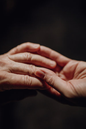 Close up of wrinkled hands, copy space.