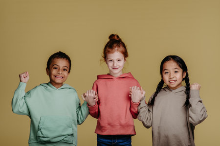 Portrait of three children, studio shoot. Concept of diversity in friendship.の写真素材