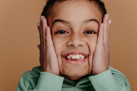 Portrait of little boy with black hair, studio shoot.