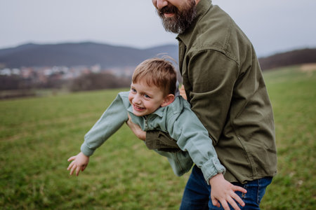 Father and his little son on a walk in nature.の写真素材