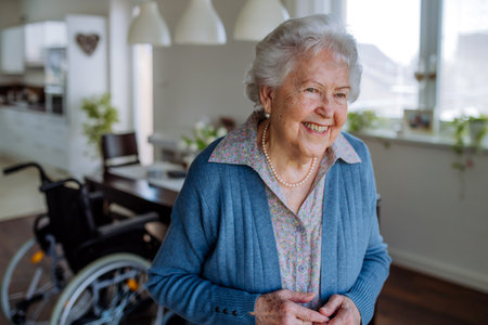 Portrait of smiling senior woman in her home.の写真素材