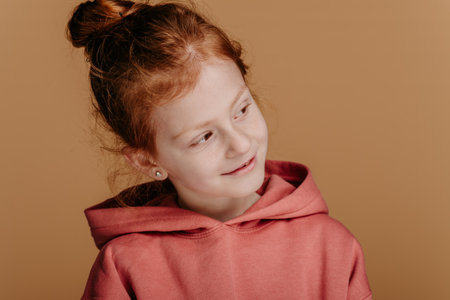 Portrait of little redhead girl, studio shoot.の写真素材