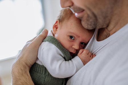 Close-up of father holding his little son.の写真素材