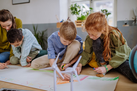 Children drawing a project to environmental lesson.の写真素材