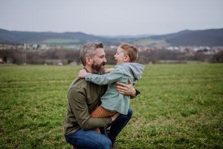 Father and his little son on a walk in nature.の写真素材