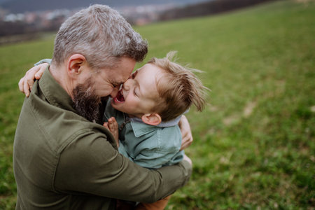 Father and his little son on a walk in nature.の写真素材