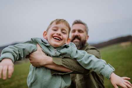 Father and his little son on a walk in nature.の写真素材