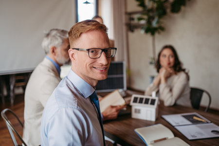 Portrait of young businessman during meeting in office.の写真素材