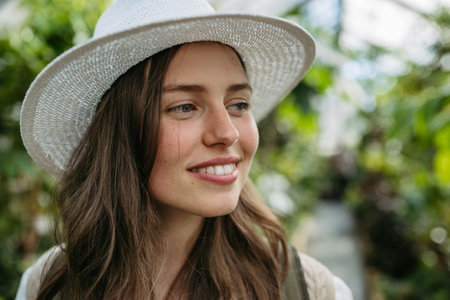 Portrait of young woman in botanical garden.