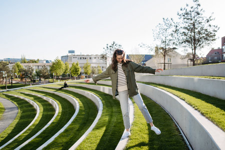 Young woman spending her free time in city park.