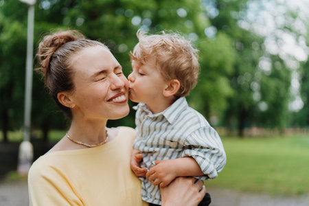 Young mother with little son on together walk after walk.