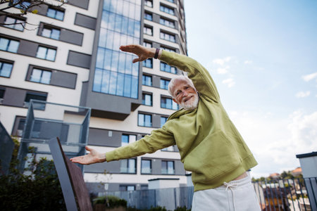 Senior man exercising outdoors in the cityの写真素材