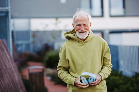 Portrait of elderly man preparing for his morning run.