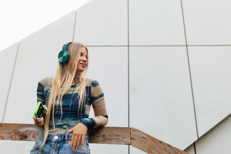Portrait of stylish generation z girl student outdoors in the city.の写真素材