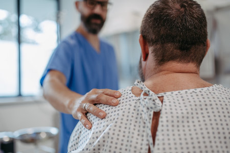 Supportive doctor soothing a worried overweight patient, discussing test result in emergency room. Illnesses and diseases in middle-aged mens health. Compassionate physician supporting stressed patient. Concept of health risks of overwight and obesity.の写真素材