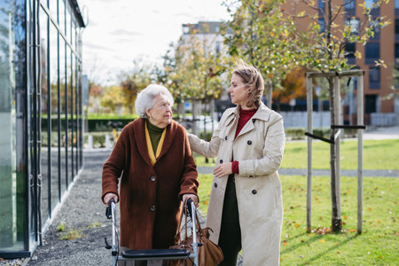 Granddaughter helping her grandmother to fill her prescription medications. Senior woman with a mobility walker and her caregiver leaving pharmacy.の写真素材