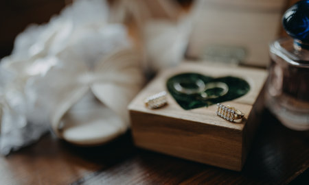 Wedding accessories for bride, earrings, rings, shoes and parfum.