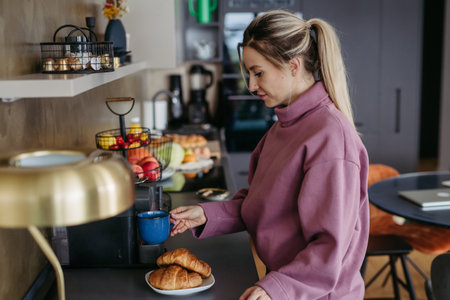 Female nurse, doctor getting ready for work, breakfast and coffee. Work-life balance for healthcare...