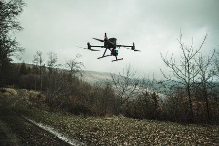 Aerial view of a drone moderning over forest, monitoring and analyzing in forestry management. Dron mapping forest after natural disaster assessing damage.の写真素材