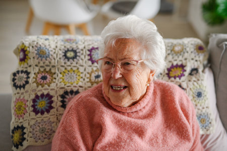 Portrait of elderly woman at home, having relaxing moment.の写真素材
