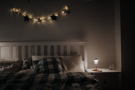Simple modern bedroom in the attic with wooden furniture and wooden floors.の写真素材