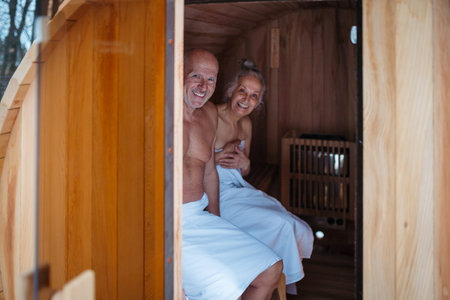 A spa sauna session for elderly man and woman. Romantic spa moment for seniors.の写真素材