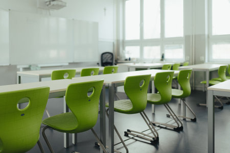 Science lab or classroom in school. Empty classroom with green plastic chairs.の写真素材