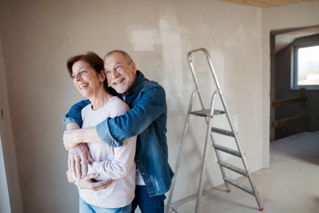 Senior couple renovating their home, a shared retirement activity.の写真素材
