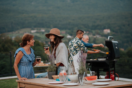 Family spending time together during spring family barbecue.の写真素材