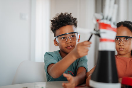 Kids building their first homemade robot at home.