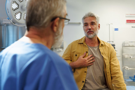 Patient sitting on examination table, describing symptoms to doctor.