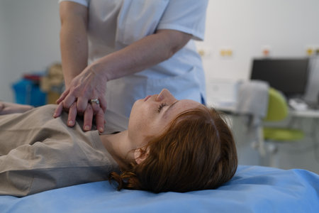 Doctors performing CPR on teenage patient in critical condition