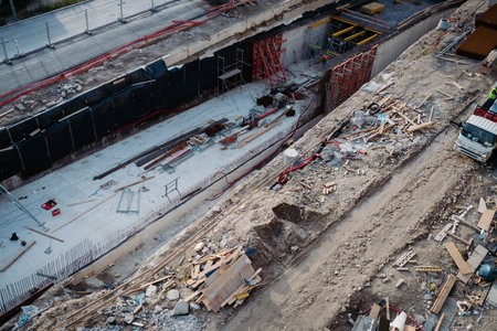 Builders working on structural development at an active construction site.の写真素材