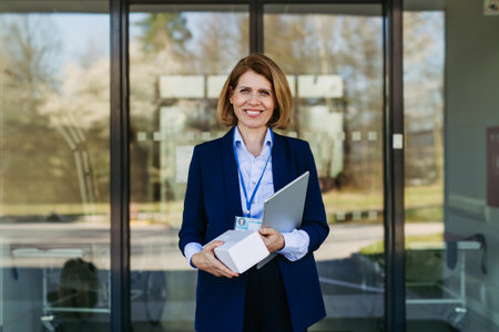 Portrait of female medical sales representative holding samples and tablet.の写真素材