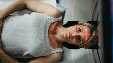 Patient positioned for head scan with laser alignment in CT scanner