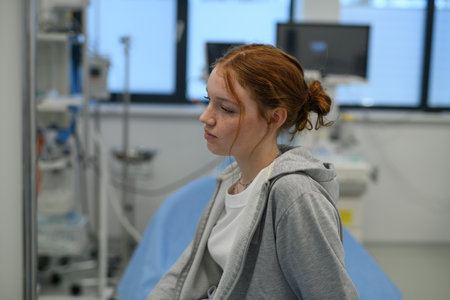 Teenage girl waiting for medical examination in hospital.の写真素材