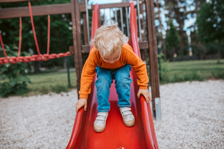 Little boy getting ready to slideの写真素材