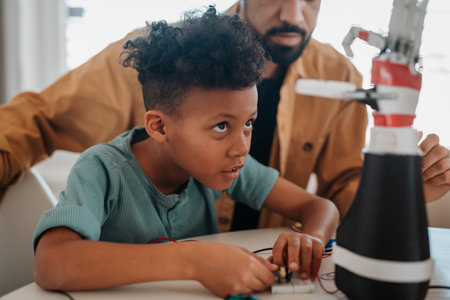 Father and son working on robotic car together. STEM concept.の写真素材