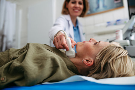 Female patient undergoing thyroid ultrasound examination