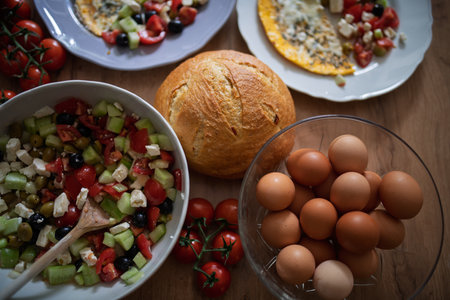 Omelet with Greek salad and fresh breadの写真素材