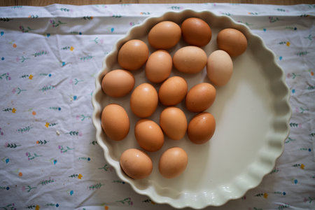 Fresh brown eggs in porcelain bowlの写真素材