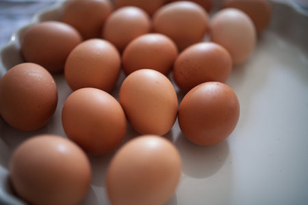 Fresh brown eggs in porcelain bowlの写真素材