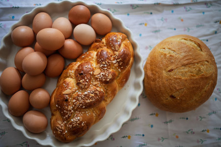 Homemade bread and eggs on rustic kitchen tableの写真素材