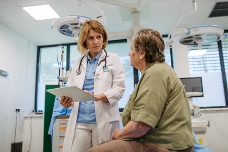 Geriatrician talking about test results with senior patient during check-up.の写真素材